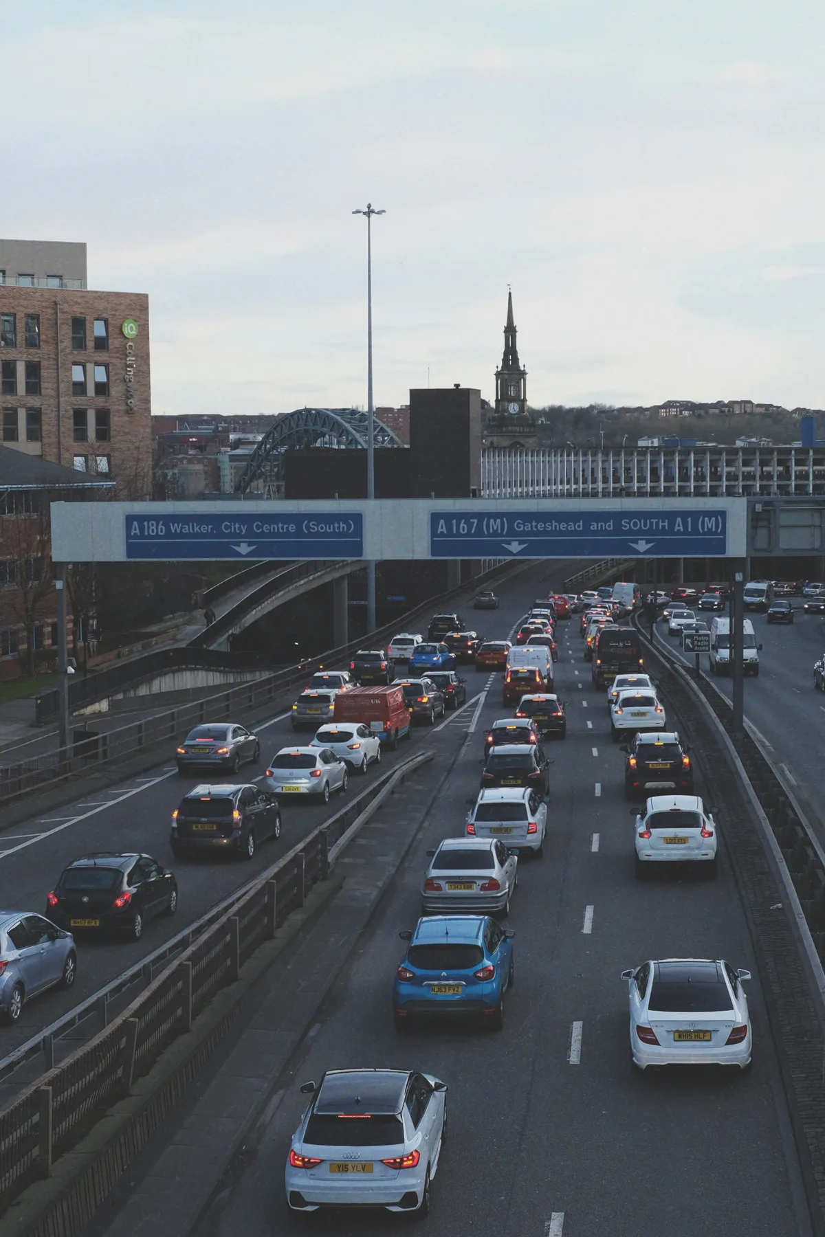 British road signs above traffic on the A167 and A186